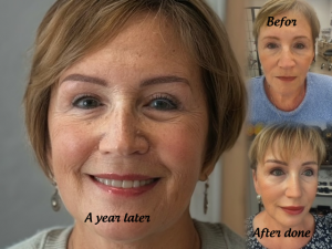 Woman smiling with youthful appearance, showcasing permanent makeup results including ombre brows, eyeliner, and lip blush, labeled "A year later," with before and after images highlighting transformation.